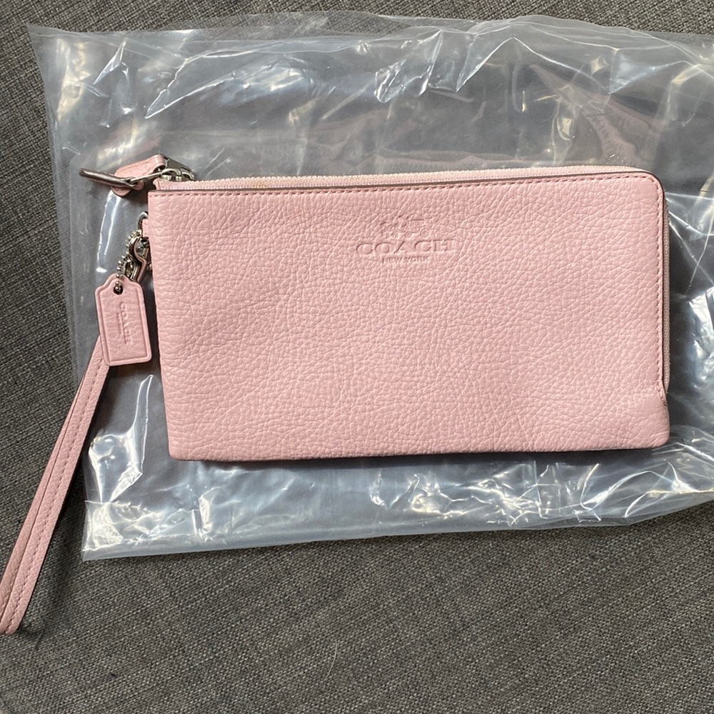 Pink coach clutch